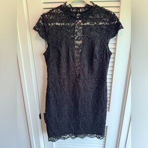 Bebe fitted black dress with detail size L